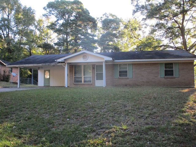 ranch-style home featuring a front yard