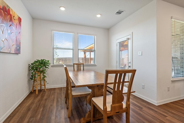 dining space featuring dark hardwood / wood-style flooring