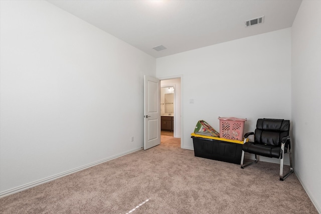 living area with light carpet