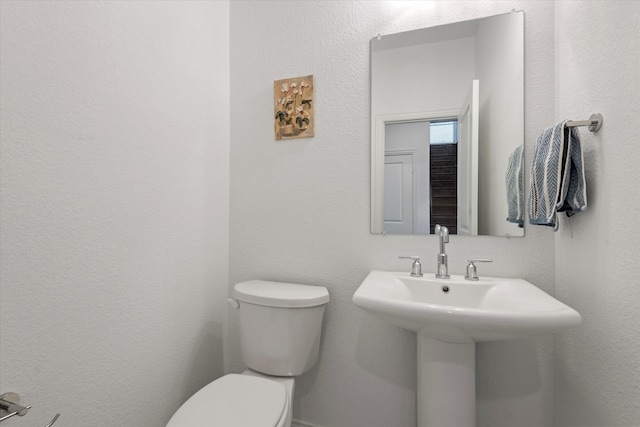 bathroom with sink and toilet