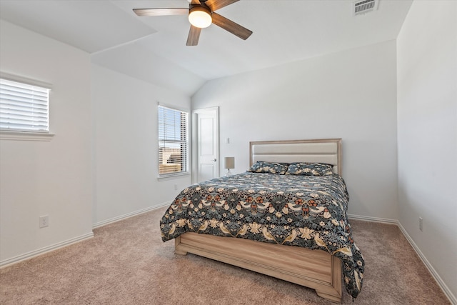 carpeted bedroom featuring ceiling fan and lofted ceiling