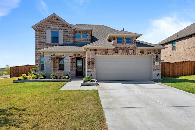 view of front facade with a garage and a front lawn