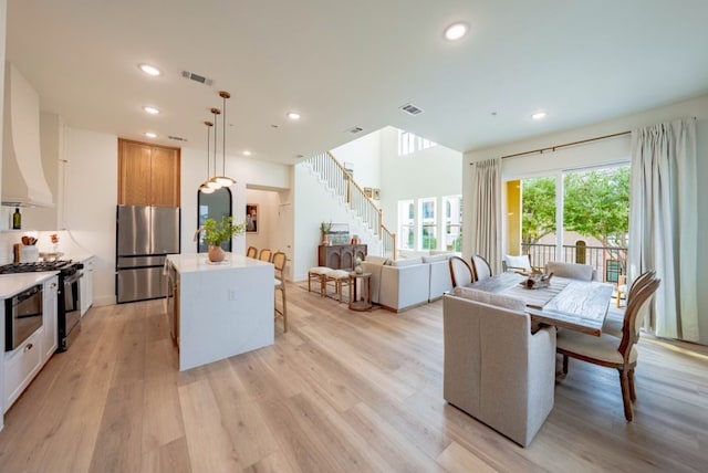 dining area featuring light wood-type flooring