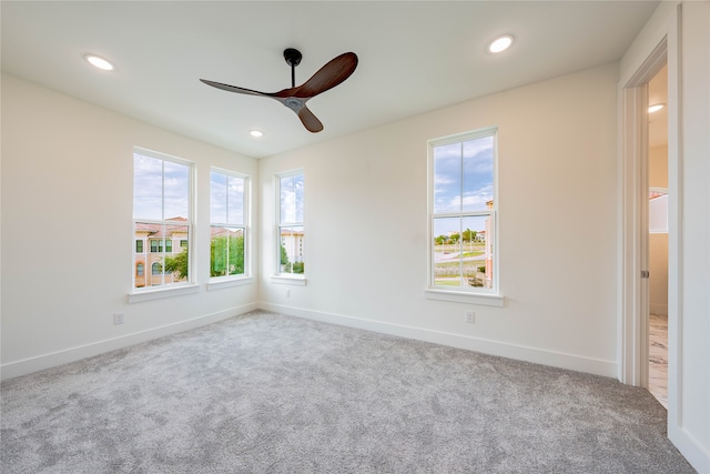 carpeted empty room with ceiling fan