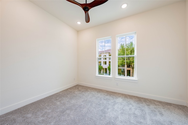 spare room with ceiling fan and carpet floors