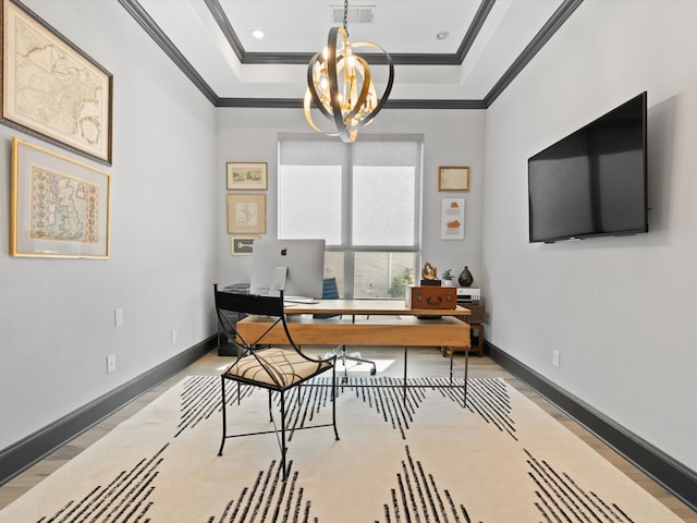 office area featuring ornamental molding, a tray ceiling, and an inviting chandelier