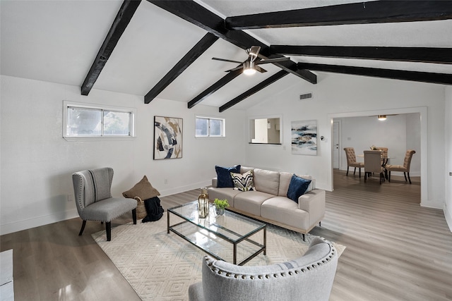 living room featuring vaulted ceiling with beams, wood-type flooring, and ceiling fan