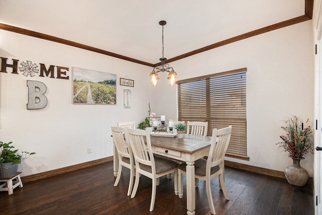 dining space featuring dark hardwood / wood-style floors, ornamental molding, and an inviting chandelier