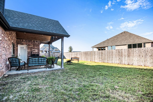 view of yard featuring a patio area and an outdoor living space