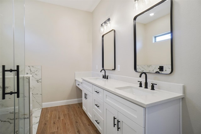 bathroom with vanity and hardwood / wood-style flooring