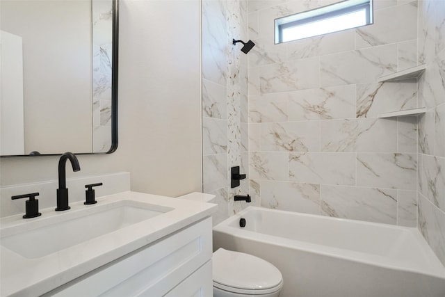 full bathroom with tiled shower / bath, toilet, and vanity