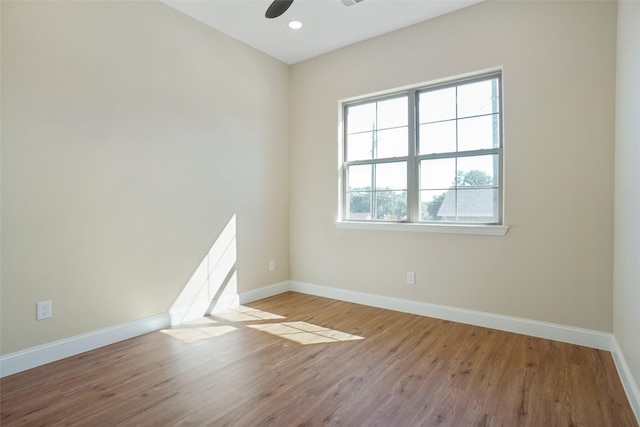 unfurnished room featuring ceiling fan and light hardwood / wood-style flooring