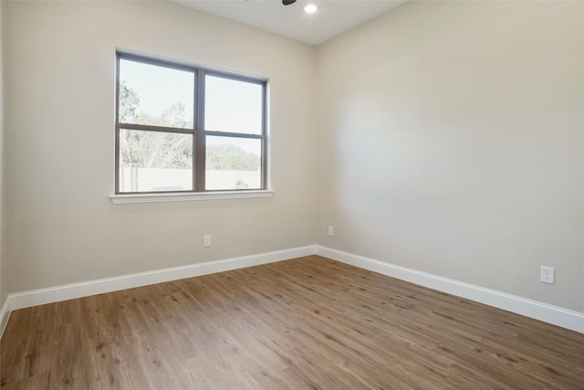 unfurnished room featuring hardwood / wood-style floors