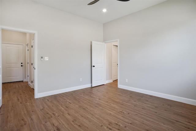 unfurnished bedroom featuring hardwood / wood-style flooring and ceiling fan