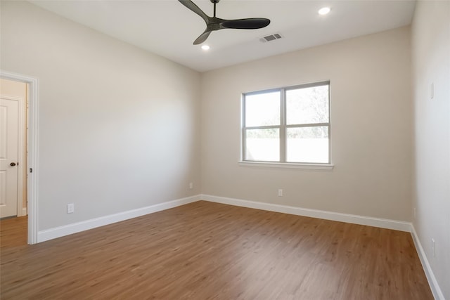 unfurnished room featuring hardwood / wood-style floors and ceiling fan