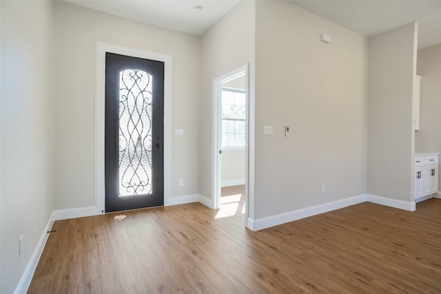 entryway with light hardwood / wood-style floors