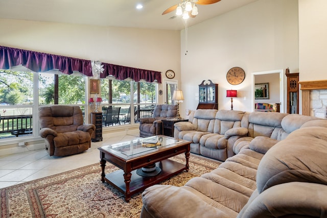 tiled living room featuring high vaulted ceiling and ceiling fan