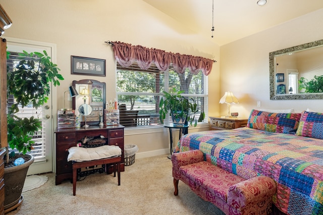 carpeted bedroom featuring lofted ceiling