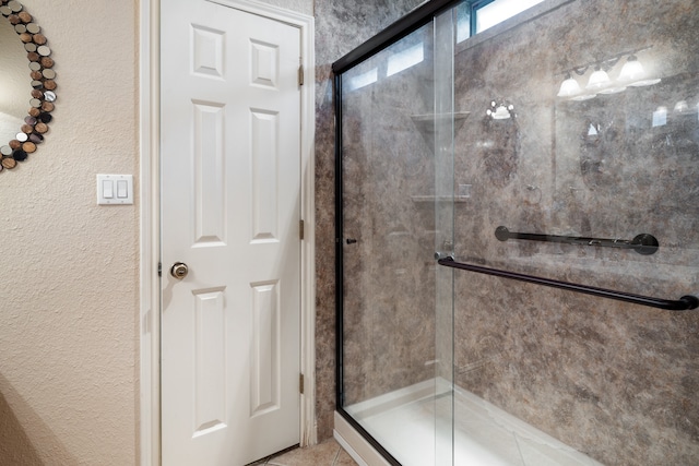 bathroom featuring tile patterned floors and walk in shower