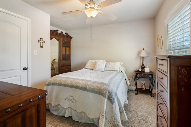 bedroom with light carpet and ceiling fan