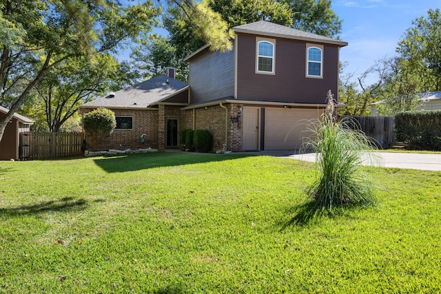 view of front of home featuring a garage and a front yard