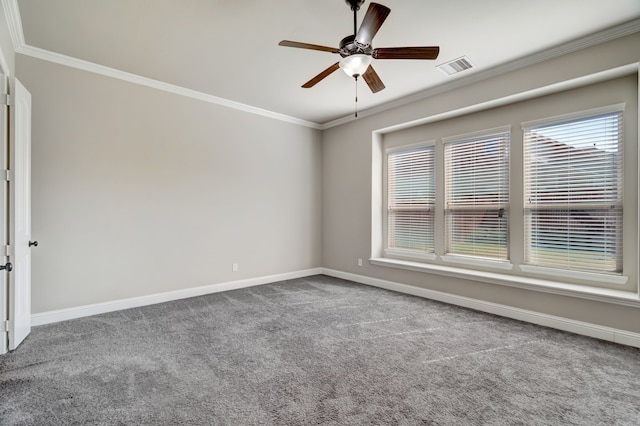 carpeted empty room featuring ornamental molding and ceiling fan