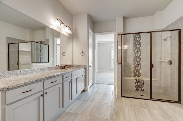 bathroom featuring vanity, tile patterned flooring, and walk in shower