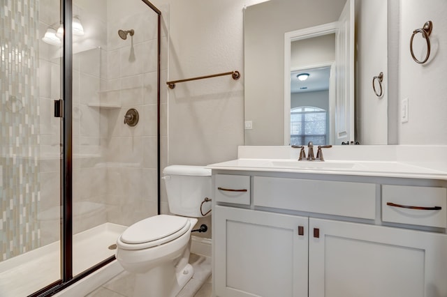 bathroom featuring vanity, toilet, tile patterned floors, and a shower with door