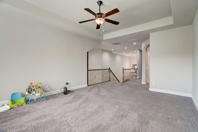 empty room featuring light carpet and ceiling fan