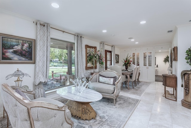 living room with french doors and ornamental molding