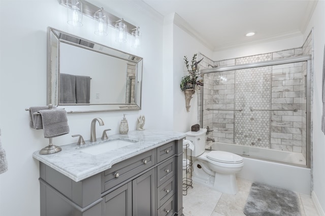 full bathroom featuring vanity, combined bath / shower with glass door, ornamental molding, and toilet