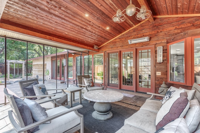 sunroom / solarium featuring vaulted ceiling with beams and wooden ceiling