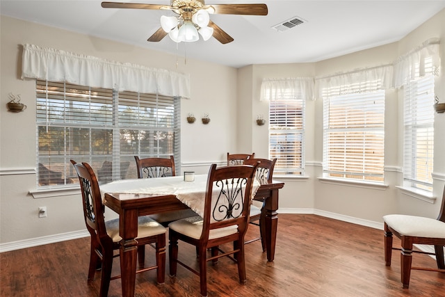 dining room featuring ceiling fan and dark hardwood / wood-style flooring