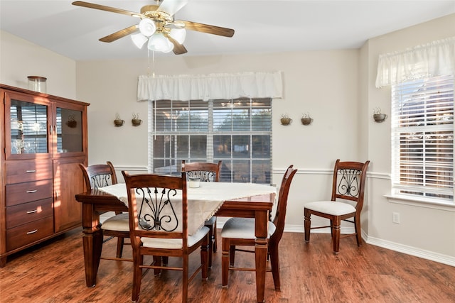 dining room with dark wood-type flooring and ceiling fan