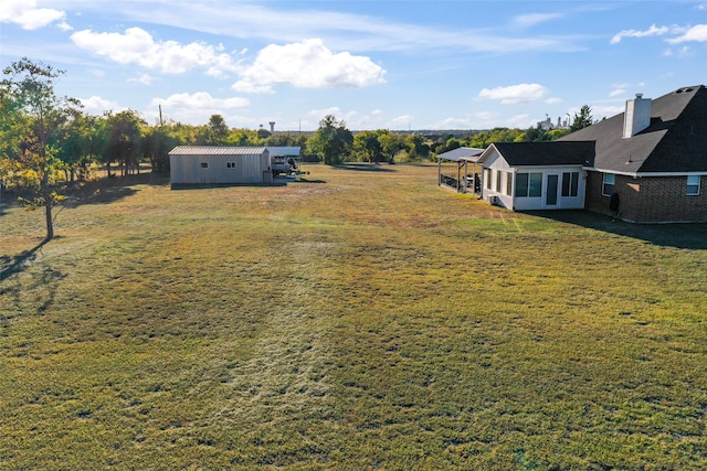 view of yard with a rural view