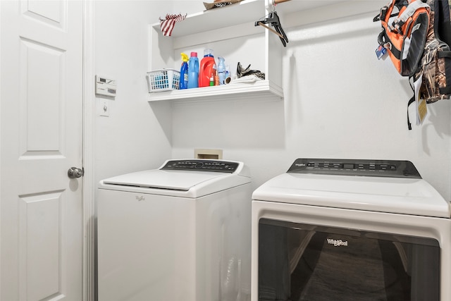 washroom featuring washer and clothes dryer