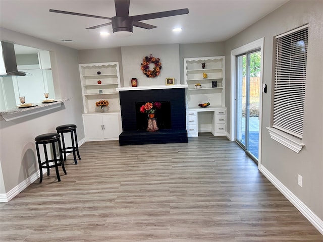 basement with light hardwood / wood-style flooring