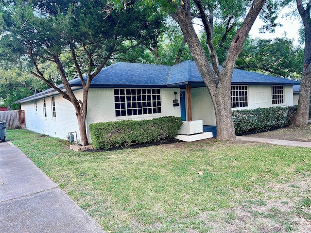 ranch-style house with a front yard