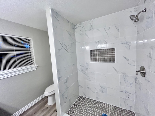 carpeted spare room featuring a textured ceiling and ceiling fan