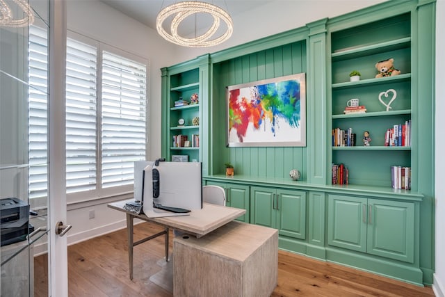 interior space featuring built in features and light hardwood / wood-style floors