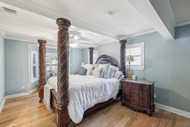 bedroom featuring light hardwood / wood-style floors, multiple windows, and ceiling fan