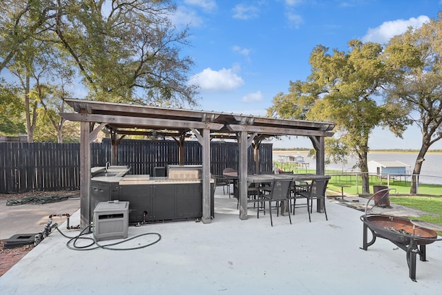 view of patio / terrace with a fire pit