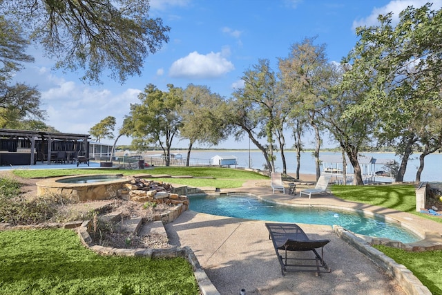 view of swimming pool featuring a patio, an in ground hot tub, a yard, and a water view