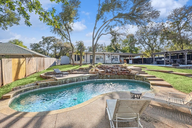 view of pool featuring a yard and a patio area