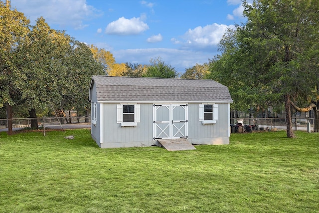 view of outdoor structure featuring a yard