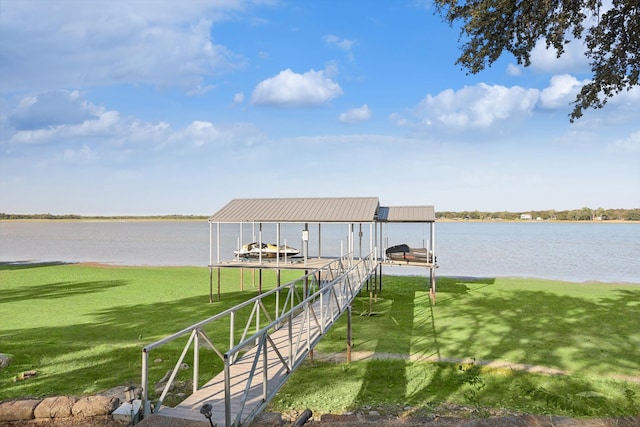 dock area featuring a water view and a lawn