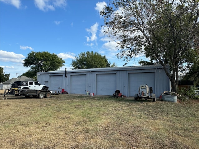 garage with a lawn