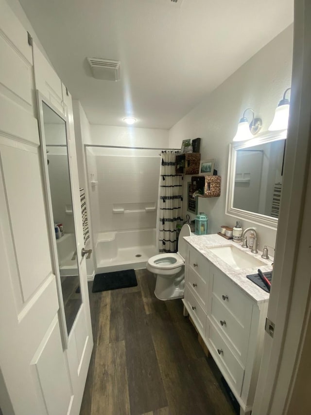 105 N 6th St E, Dawson, TX 76639 - bathroom with wood finished floors, a shower stall, and vanity