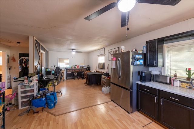 kitchen featuring light hardwood / wood-style flooring, stainless steel fridge, and ceiling fan