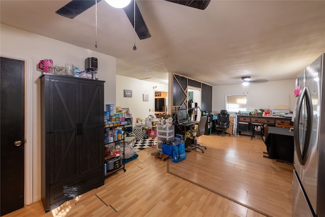 miscellaneous room featuring ceiling fan and hardwood / wood-style flooring